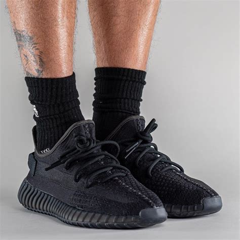 The adidas YEEZY SLIDE Onyx is constructed fully of lightweight and durable EVA foam. . Yeezy onyx on feet